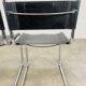 Paire de chaises cantilever simili cuir noir et chrome
