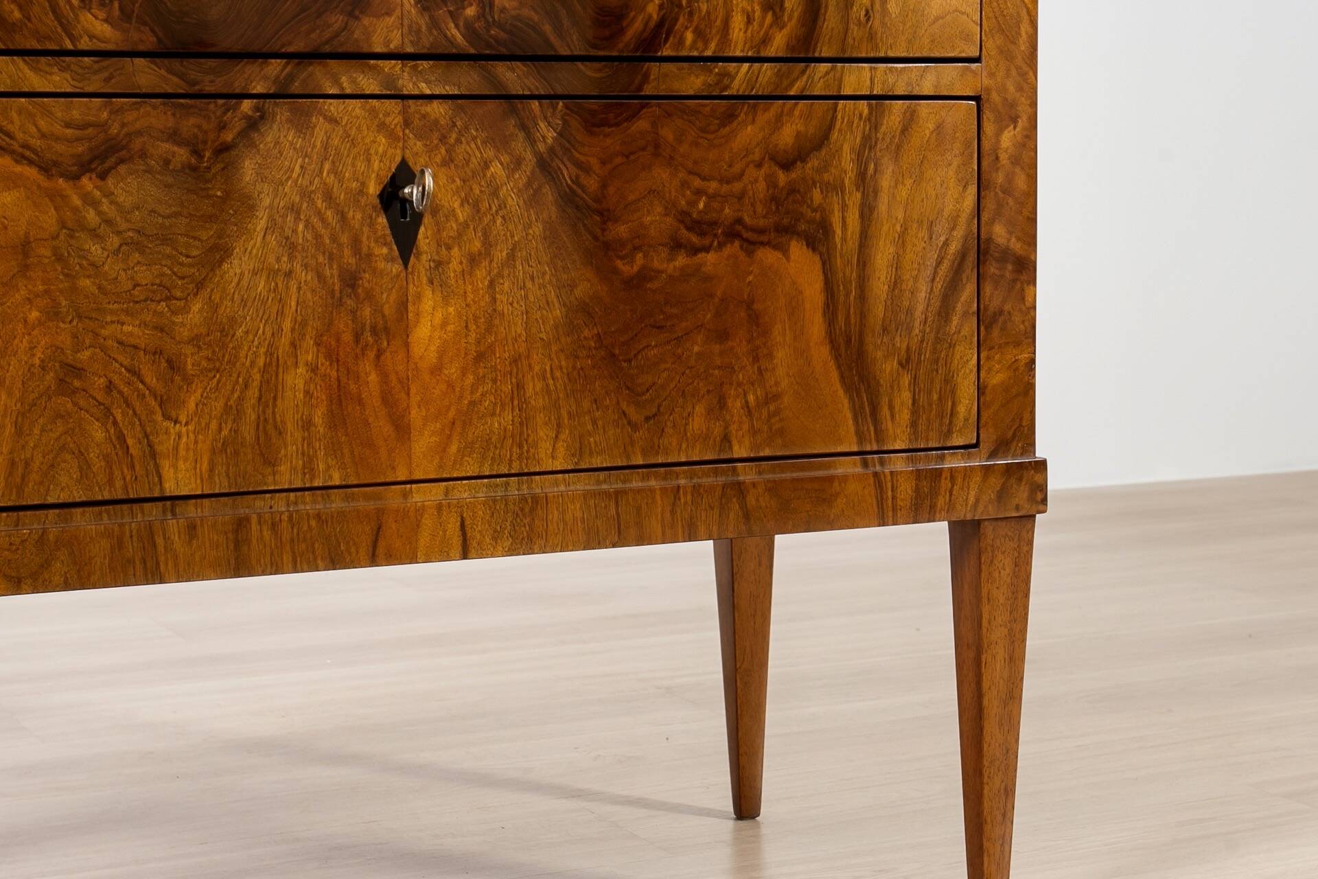 Elegant pair of Biedermeier style walnut commodes, Germany, French polish.