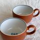 2 very and earthenware coffee cups