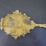 Hand-facing mirror in gilded bronze