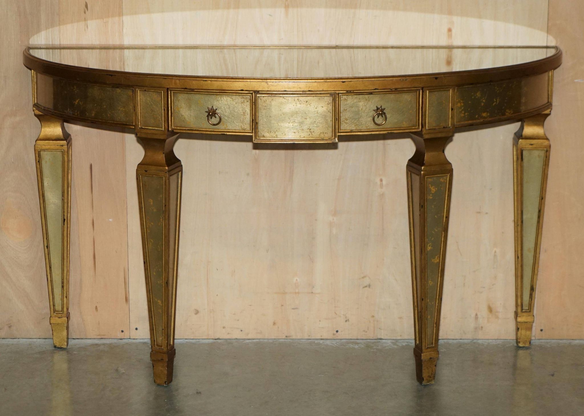 Half-moon console Eglomise Theodore Alexander with a gold finish.