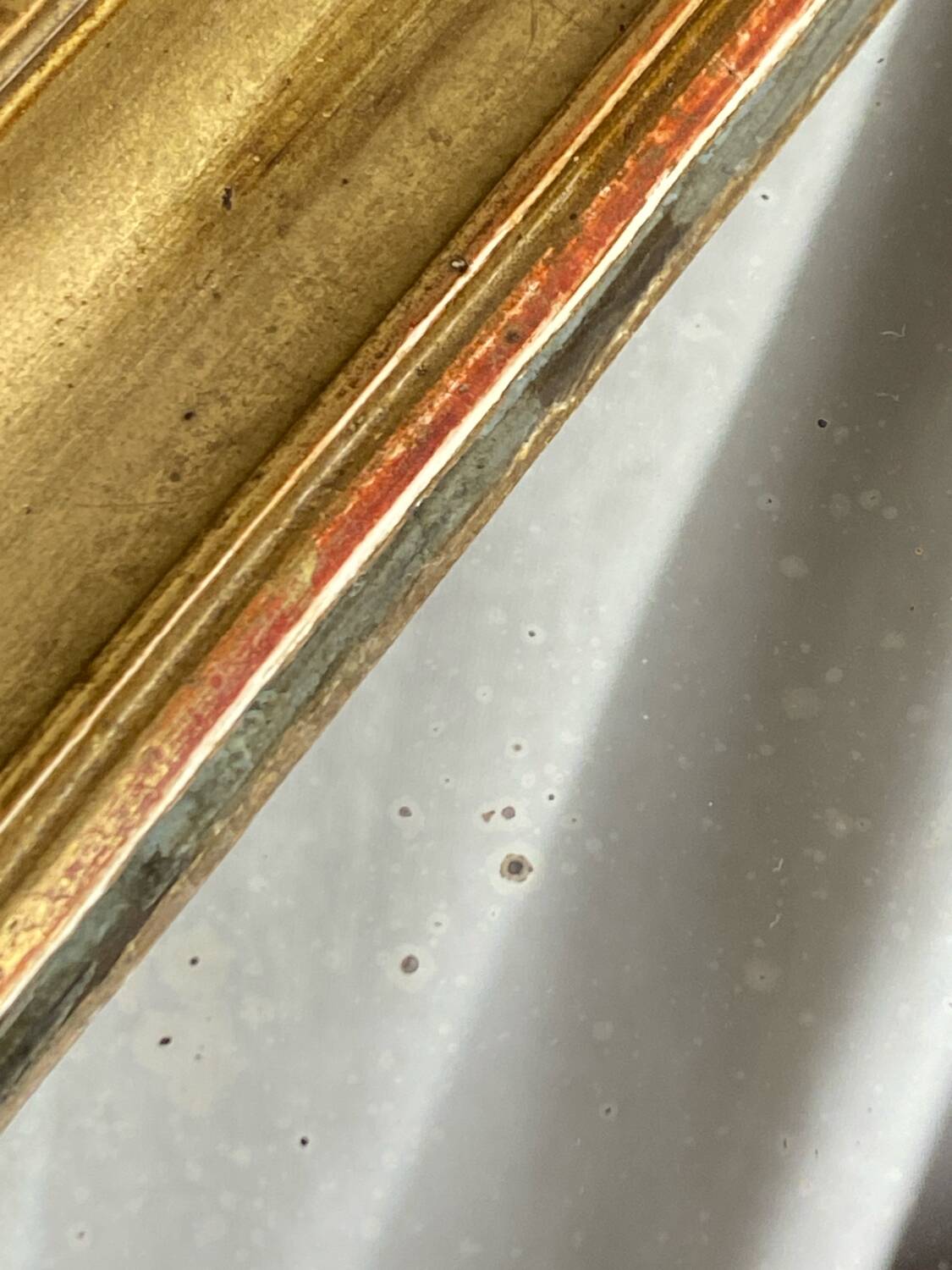 Antique mirror in gilded wood