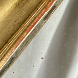 Antique mirror in gilded wood