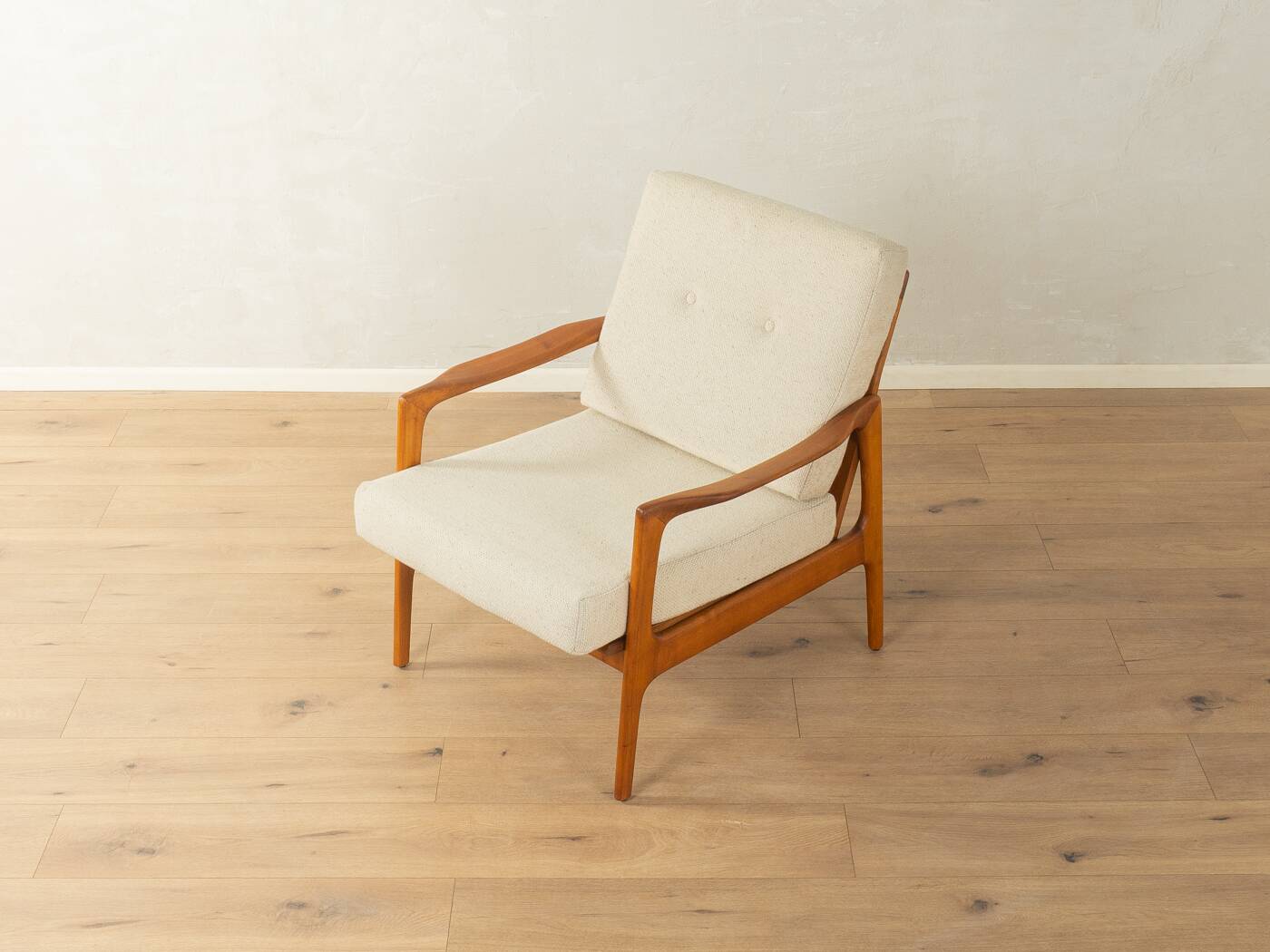 Elegant mid-century armchair from the 1960s with cream-white upholstery