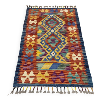 Afghan kilim rug in multicolored wool, geometric patterns