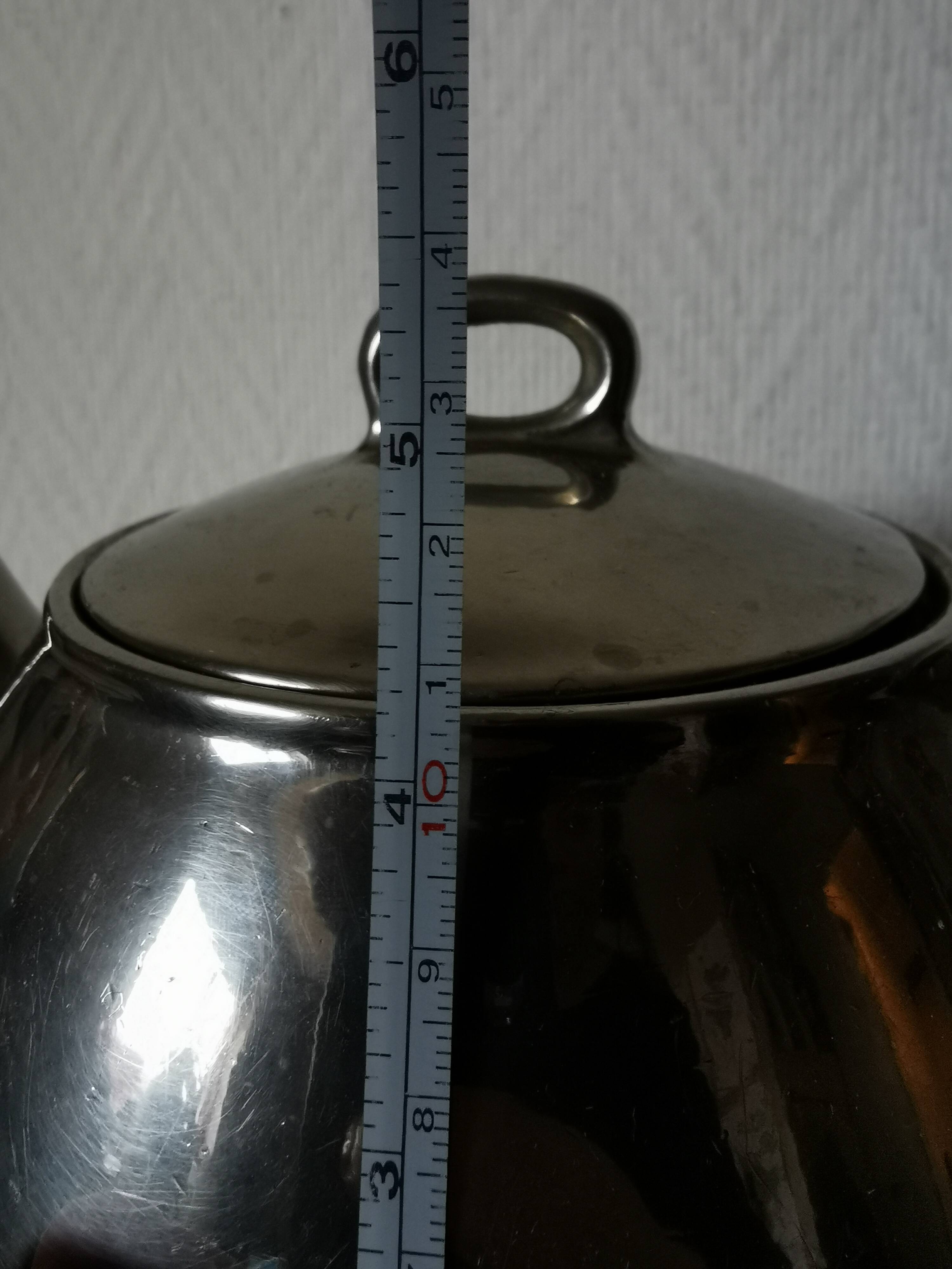 vintage teapot covered with silver metal