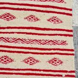 Traditional ethnic-patterned red and white carpet
