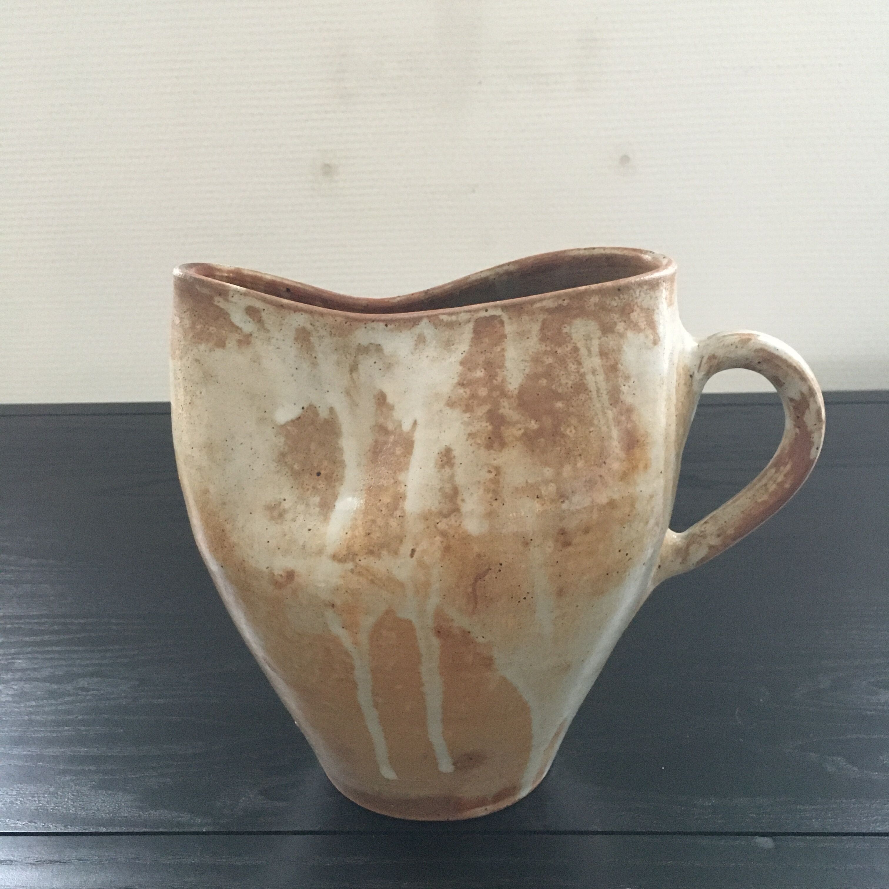 Beige stoneware pitcher with white drips