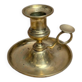 Antique brass candlestick with pusher