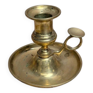 Antique brass candlestick with pusher