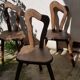 3 brutalist wooden tripod chairs