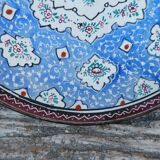 Decorative plate in blue enameled metal with bird motifs