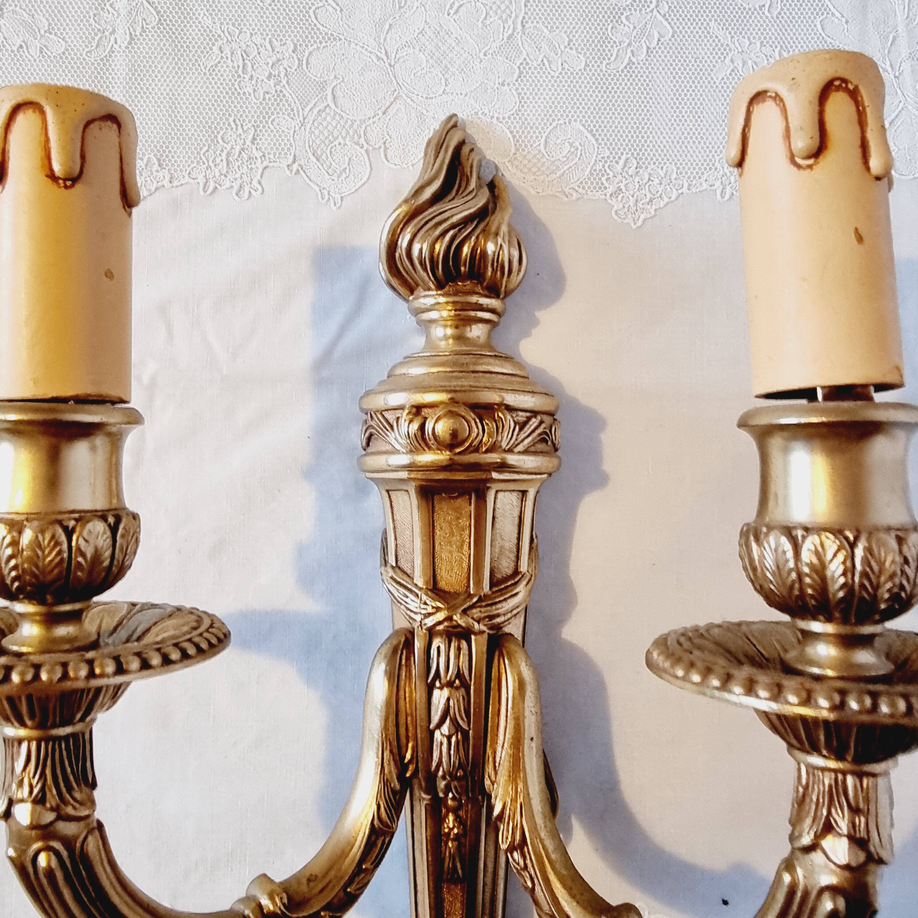 Pair of Louis XV style rocaille two-armed sconces in gilded bronze