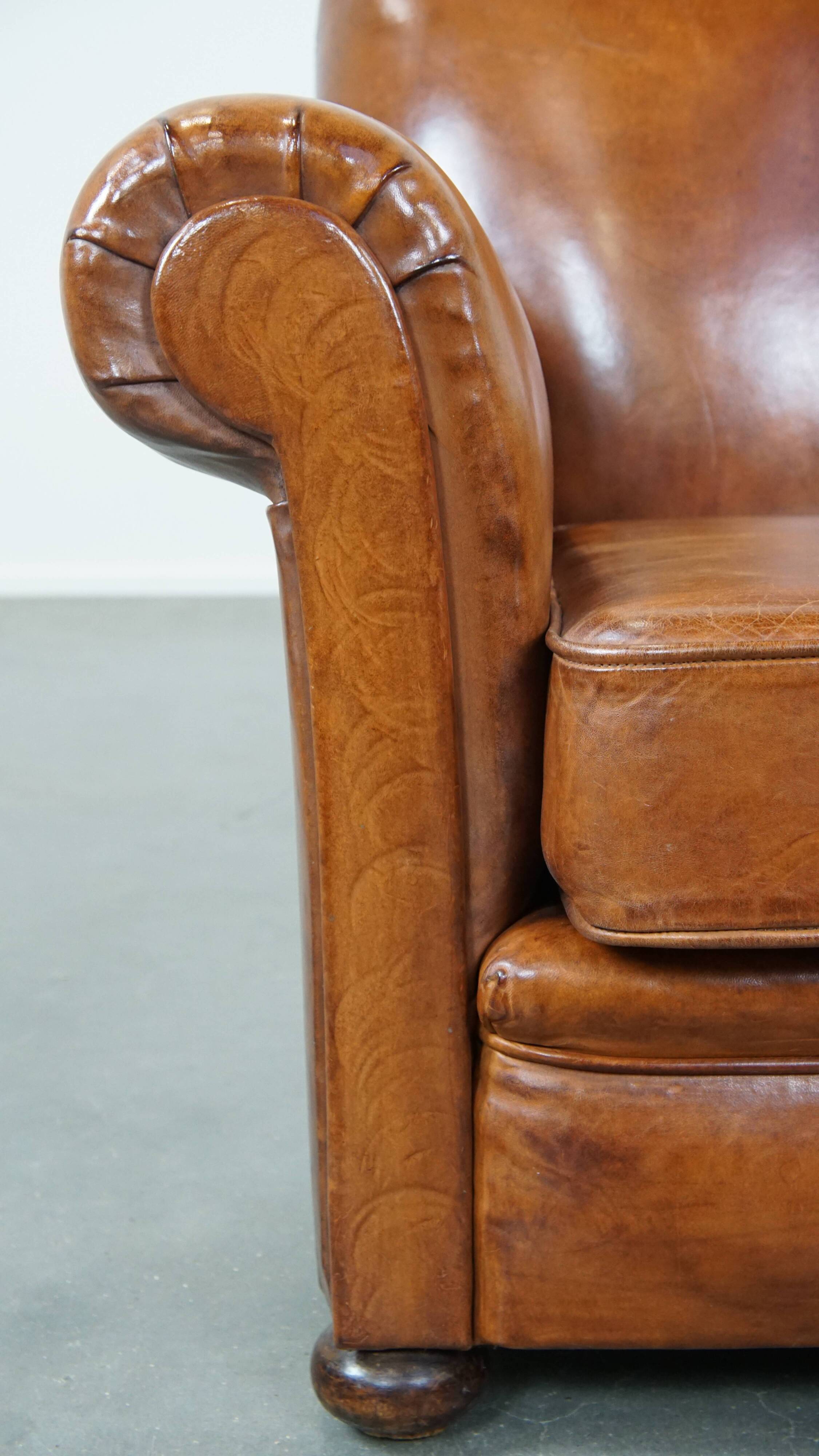Cognac-colored antique sheep leather armchair