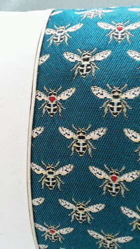 Cushion cover Bee fabrics on emerald green background