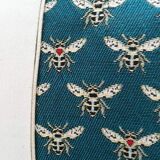 Cushion cover Bee fabrics on emerald green background