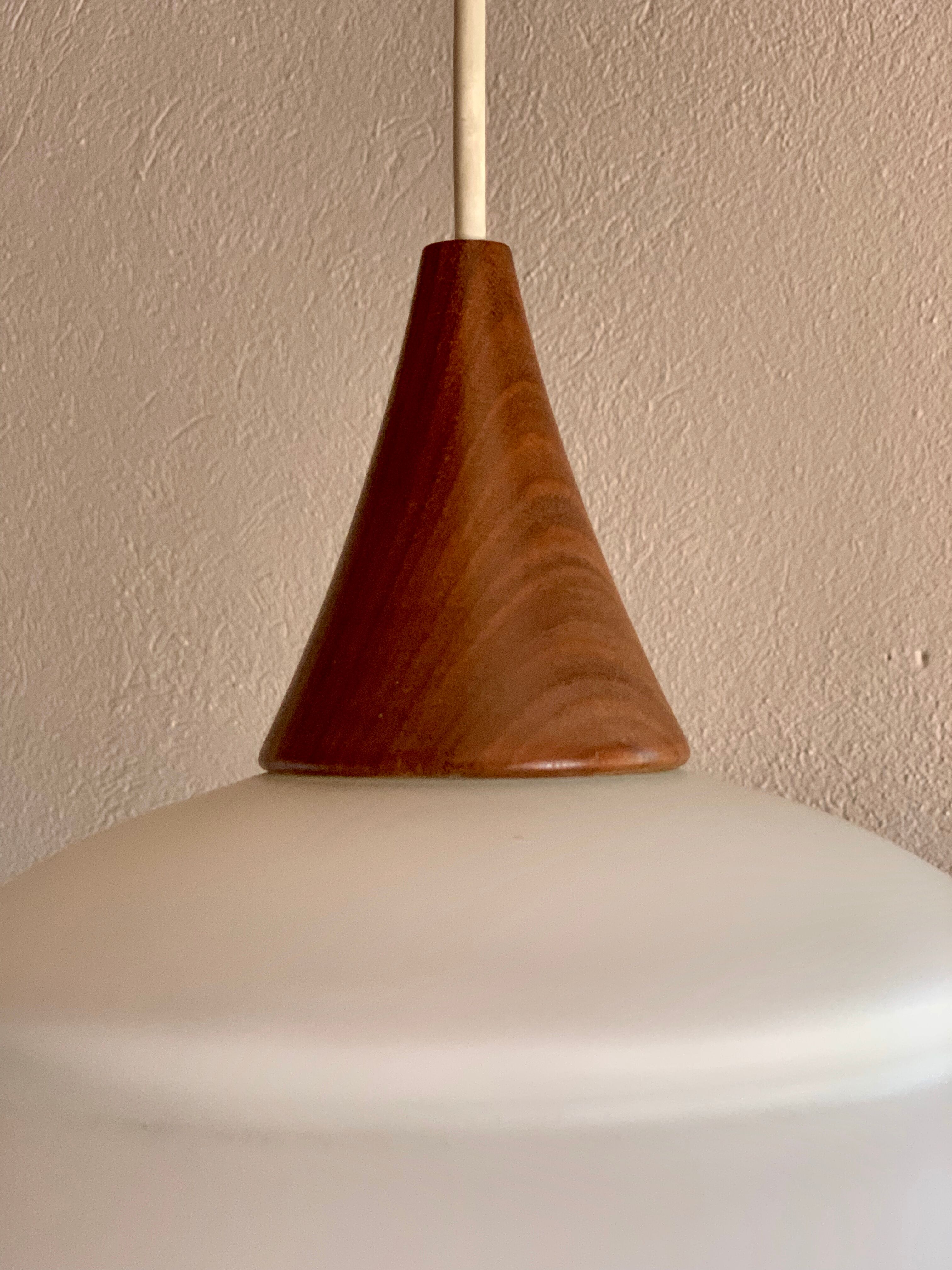Vintage teak and opaline pendant lamp by Louis Kalff for Philips