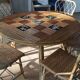 Round dining table Audoux Minet with 4 chairs and 2 armchairs.