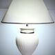 Vintage white ceramic table lamp, ribbed body and conical shade.