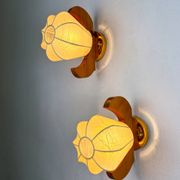 Pair of pear-shaped "Cocoon" wall sconces, resin and pine wood, Italy, circa 1970s