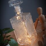 Old whisky carafe in relief glass