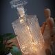 Old whisky carafe in relief glass