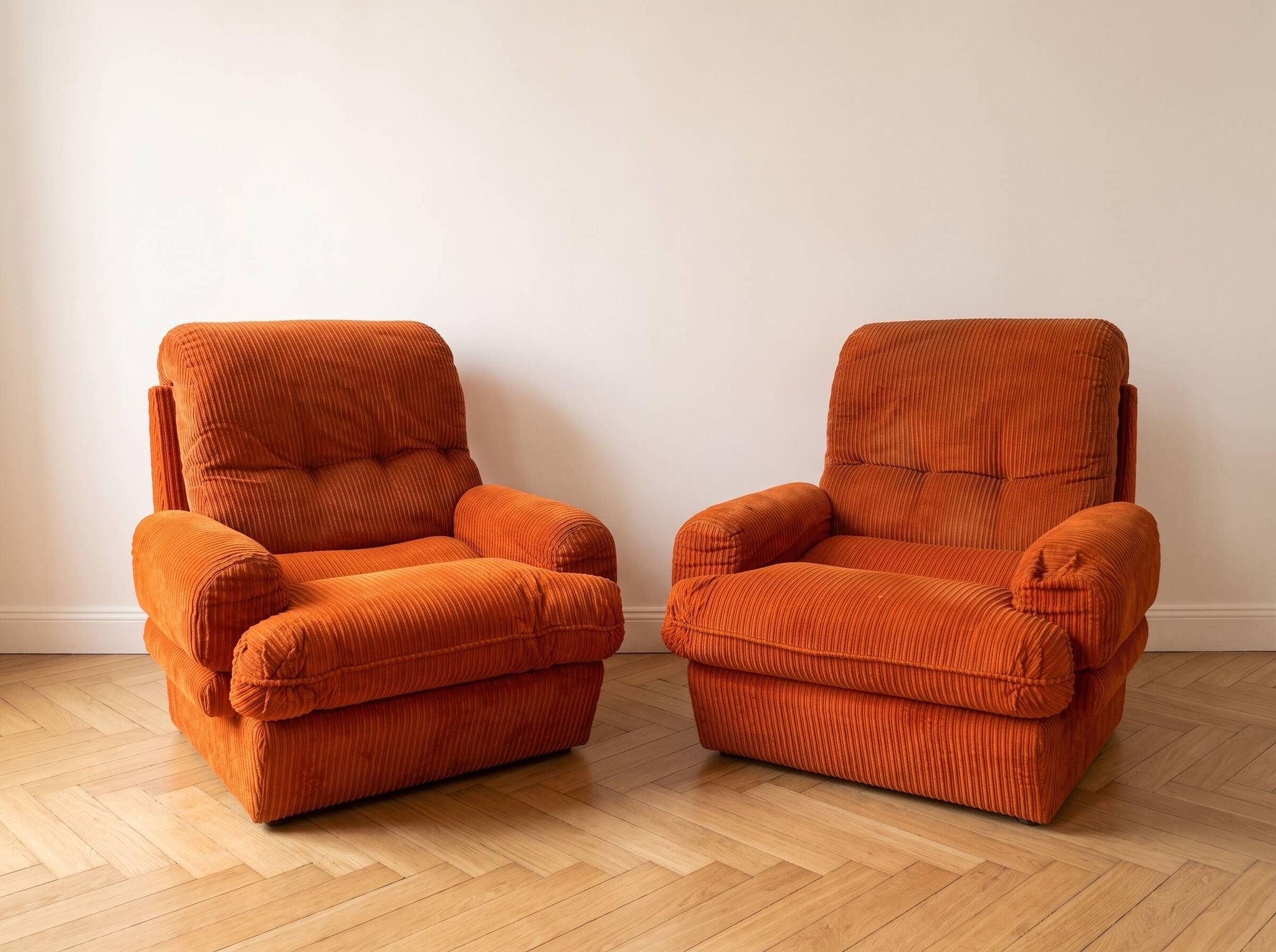 Pair of orange corduroy armchairs, 1970s