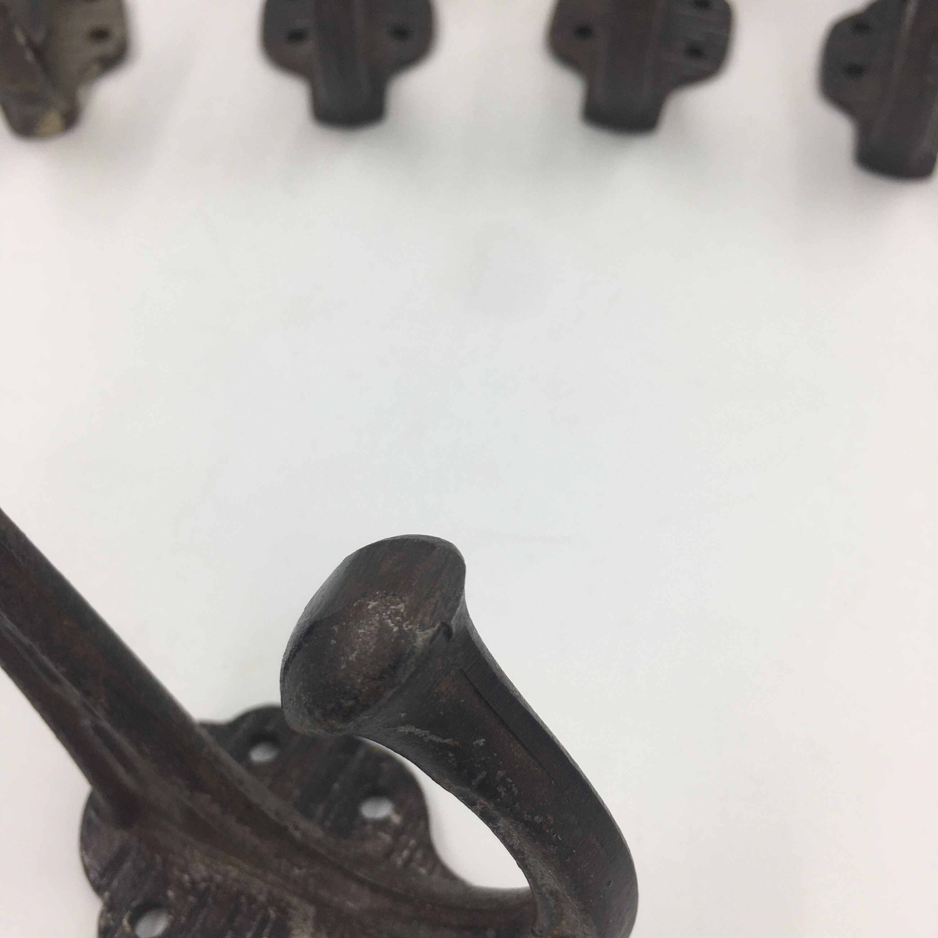 Set of 5 cast iron hooks early 20th