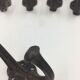 Set of 5 cast iron hooks early 20th