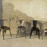 Four stackable chairs with industrial style