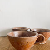 Three antique stoneware cups