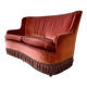 Vintage two-seater armchair in powder pink velvet with fringes.