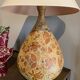 Ceramic lamp with floral decorations