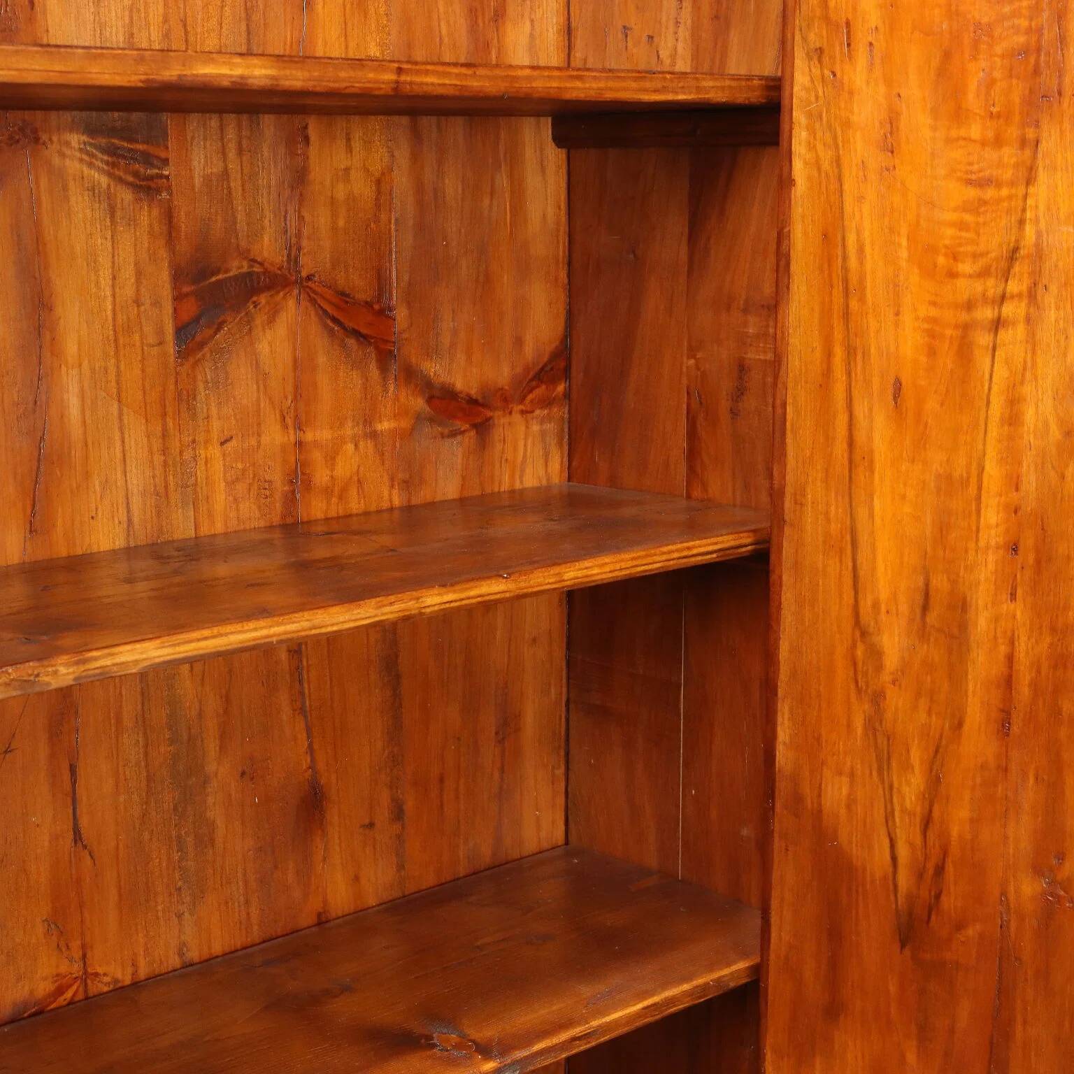 Vintage walnut wardrobe with exposed hardware.