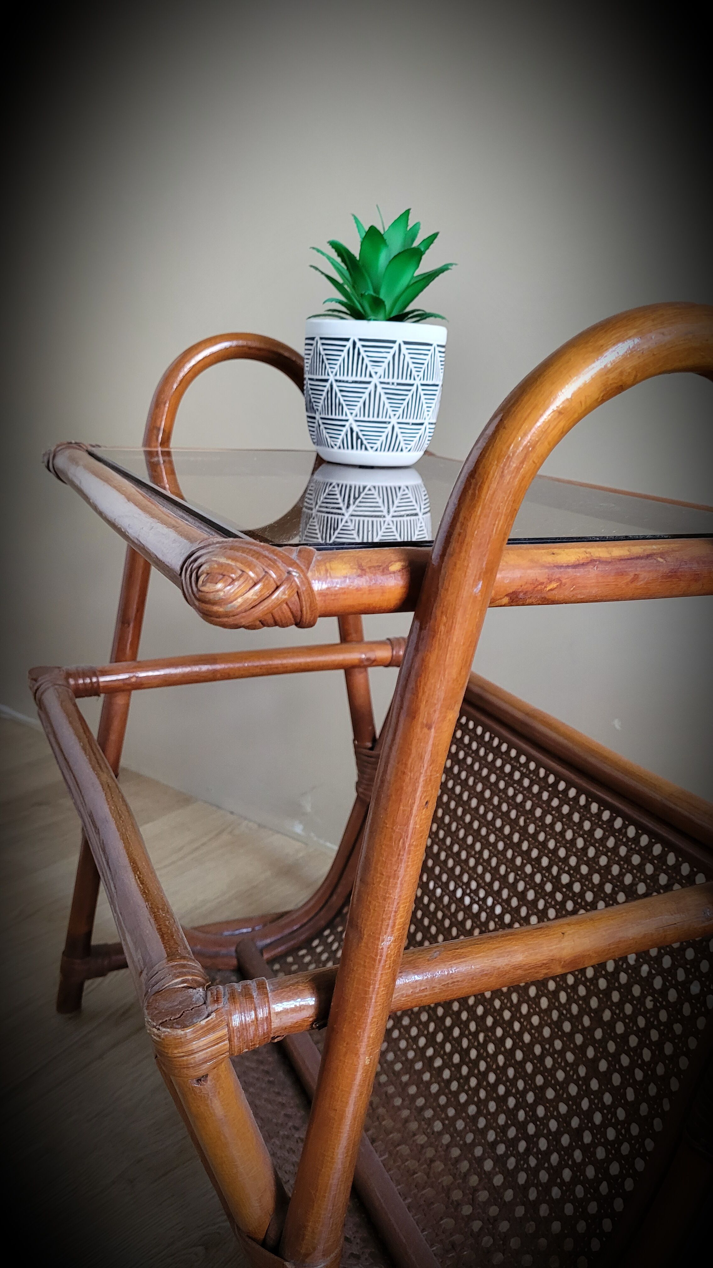 Braided rattan side table and smoked glass