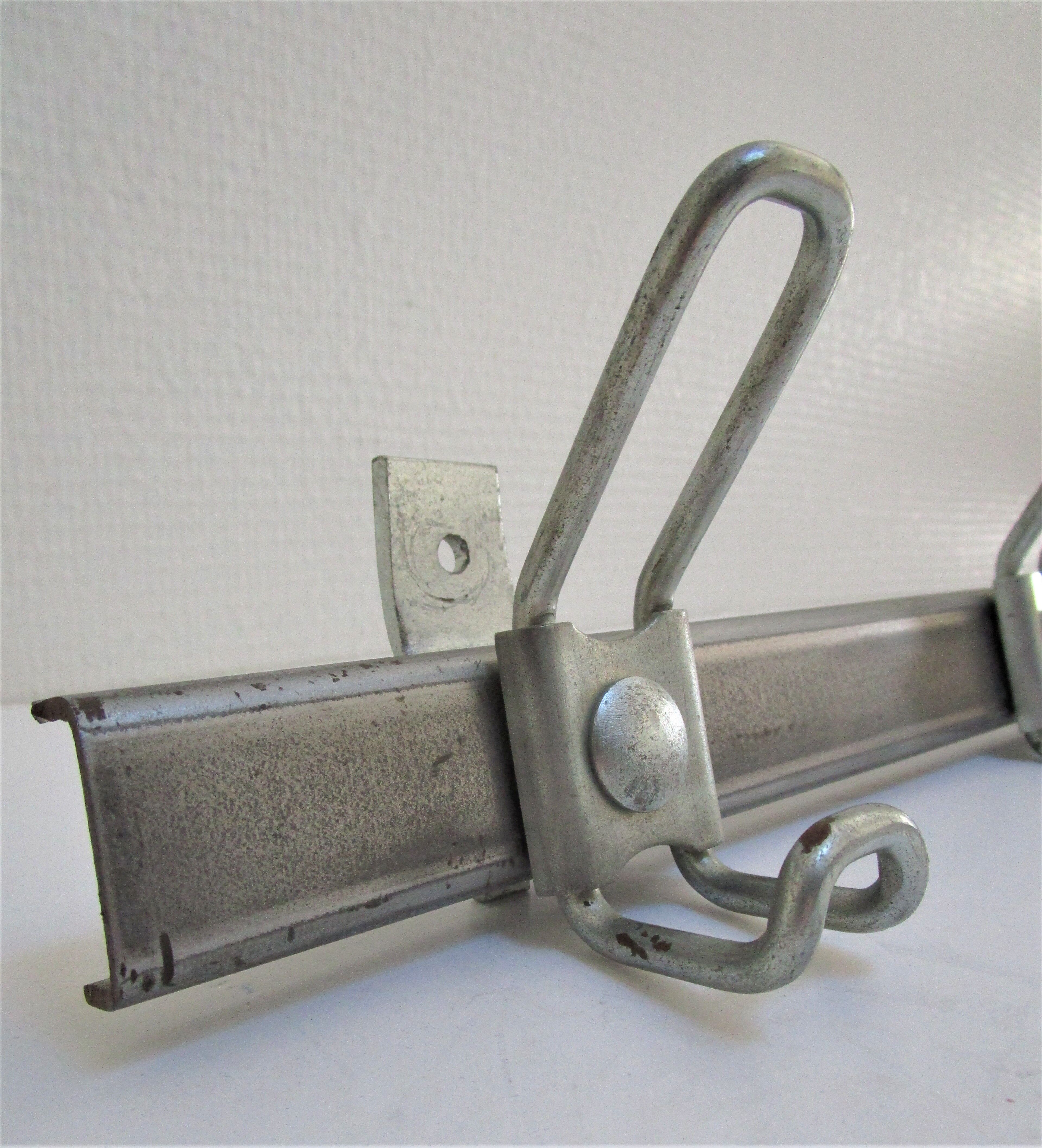 Vintage school wall rack in patinated steel