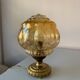 Old vintage table lamp made of amber molded glass