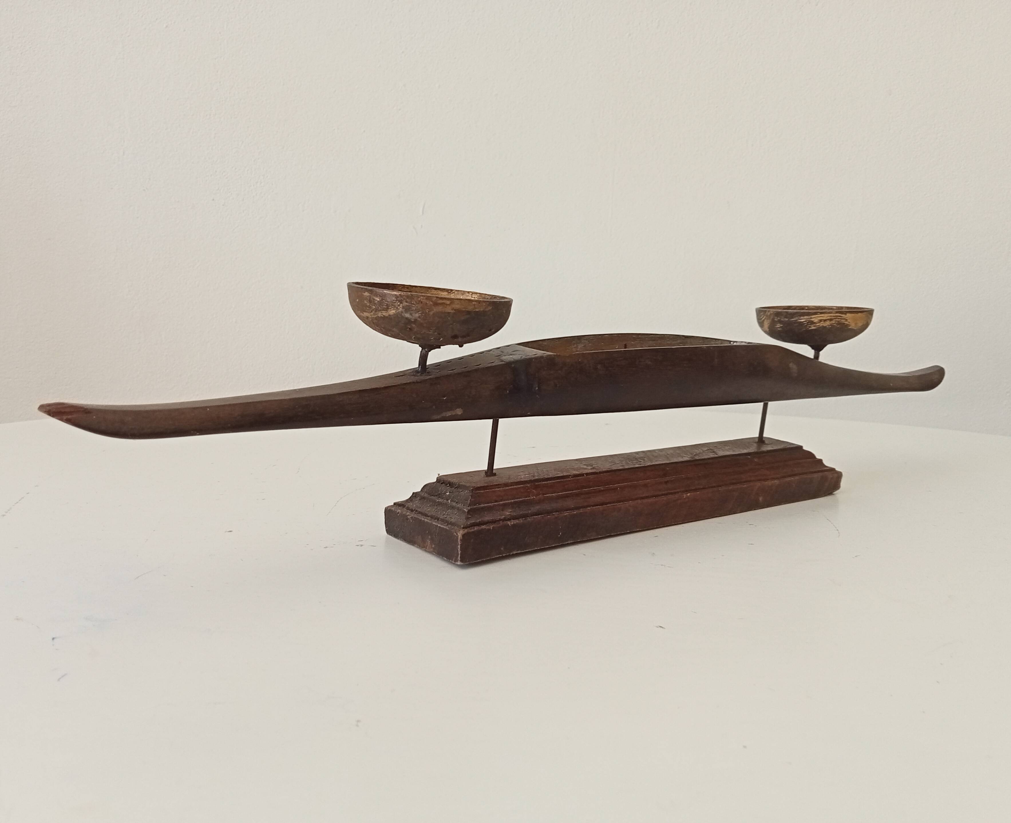 Vintage chandelier in solid carved teak.