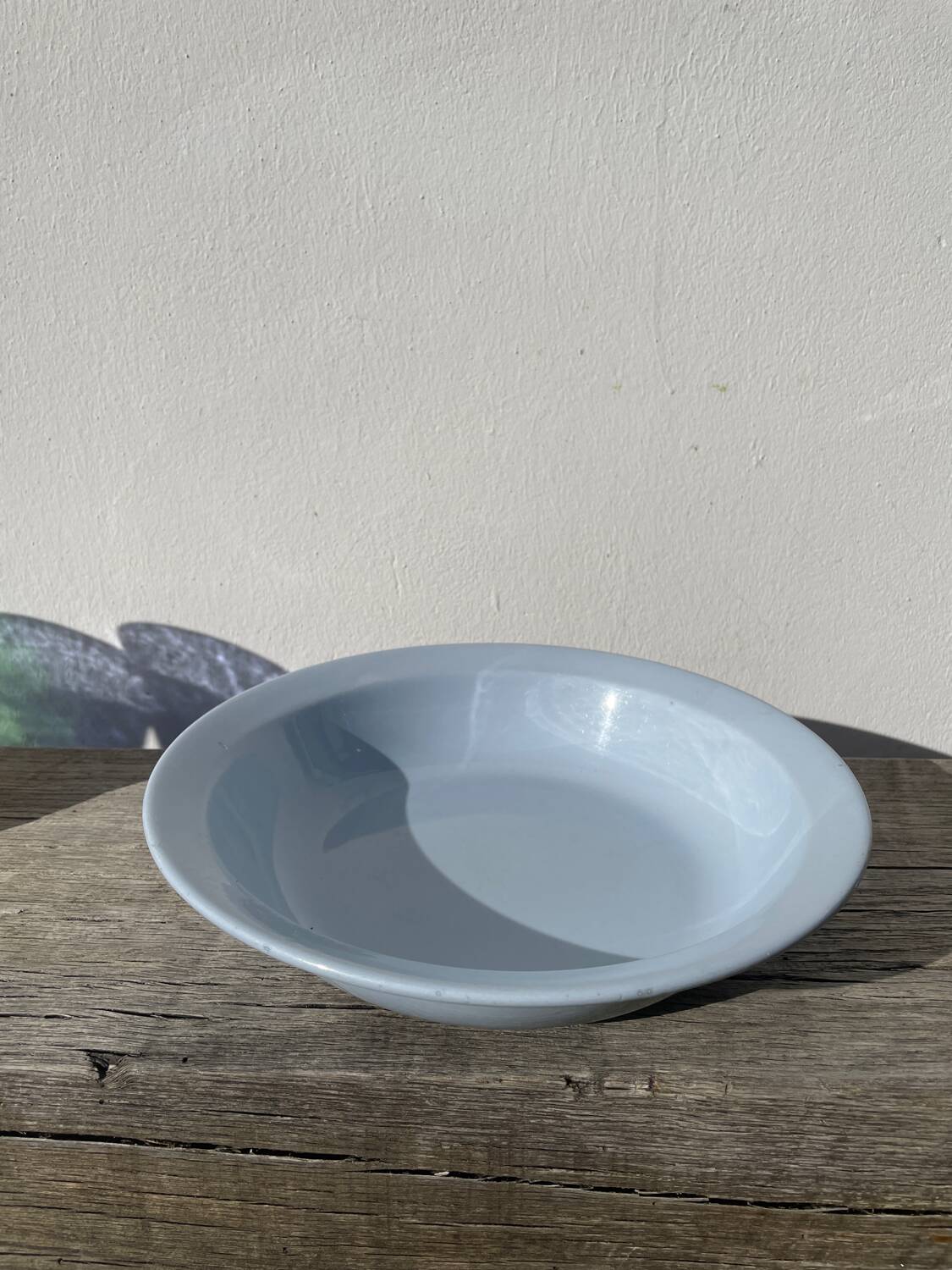 Round, flat, sky-blue ceramic salad bowl from Moulin des Loups
