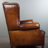Luxurious large sheep leather wingback armchair with beautiful colors and amazing patina