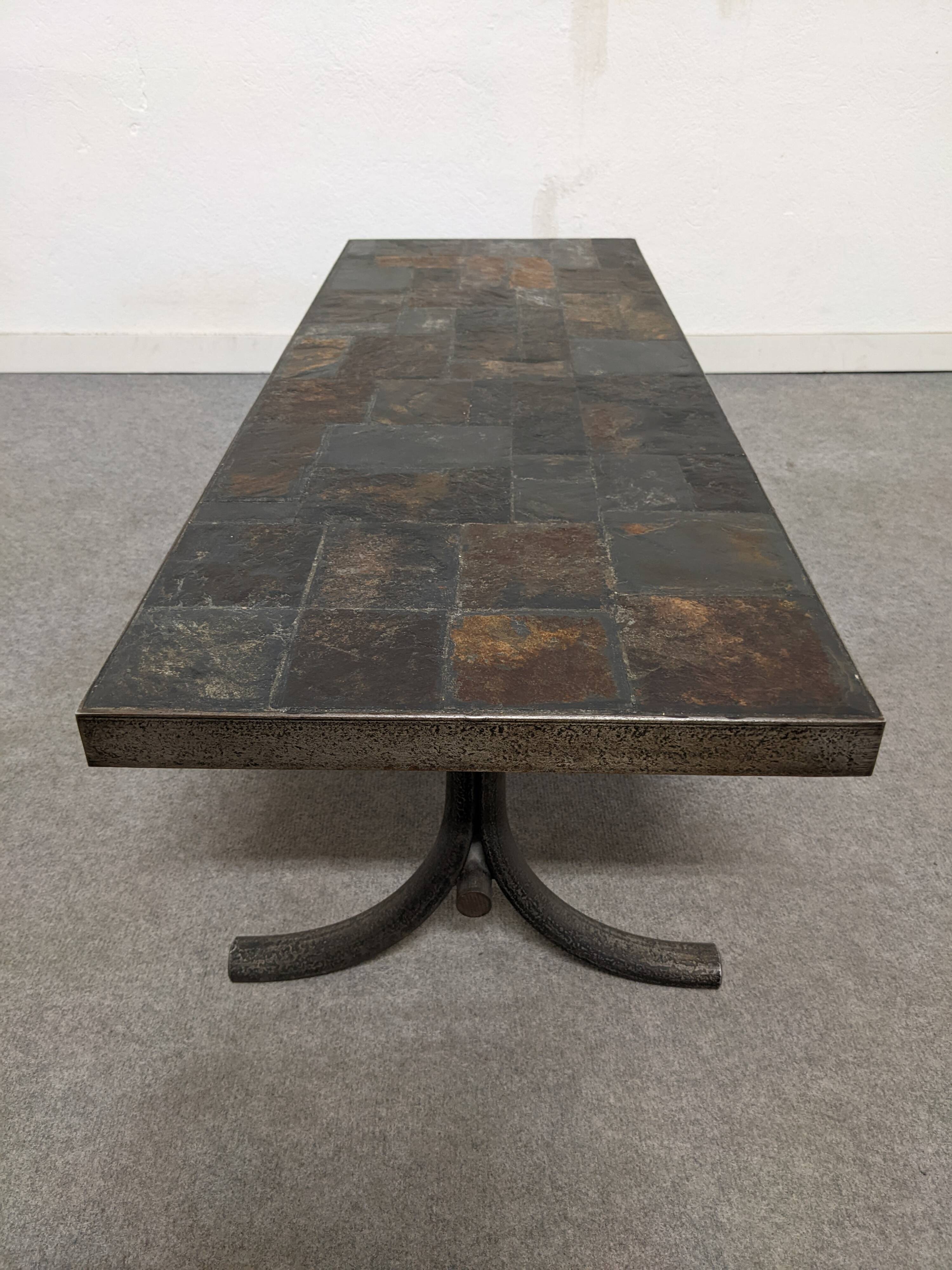 Brutalist coffee table in natural stone and wrought iron, France circa 1960.