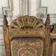Pair of corner armchairs and an Orientalist bench in carved and polychrome wood from around 1900.