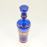 Blue glass decanter with gold decoration