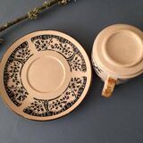 Large stoneware cup and saucer with delicate floral patterns