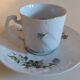 Tasse et sous-tasse en porcelaine décor aux marguerites 1900
