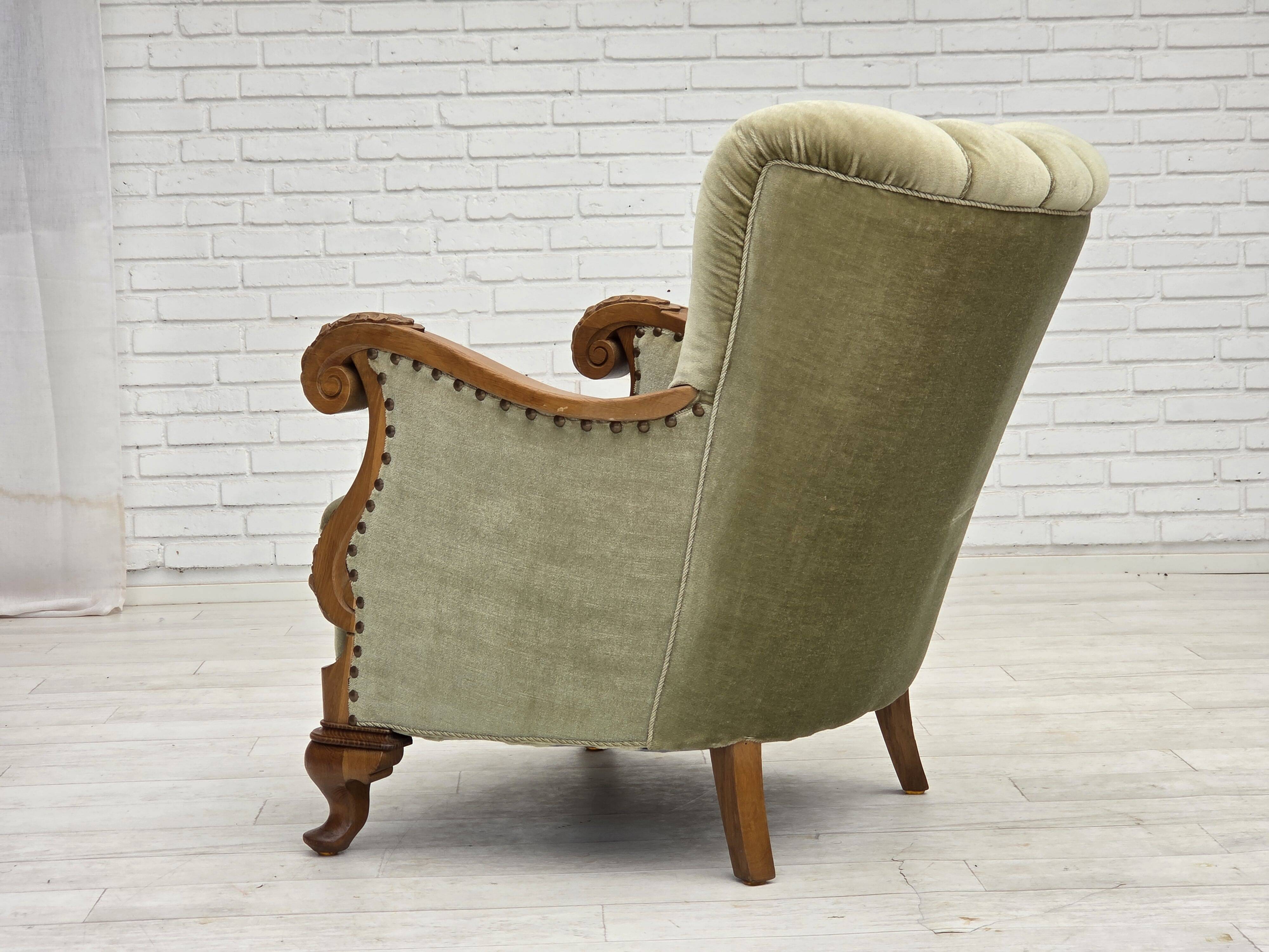 1960s, Danish armchair, green furniture velour, carved oak wood.