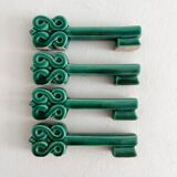 4 green ceramic knife rests in vintage key shape