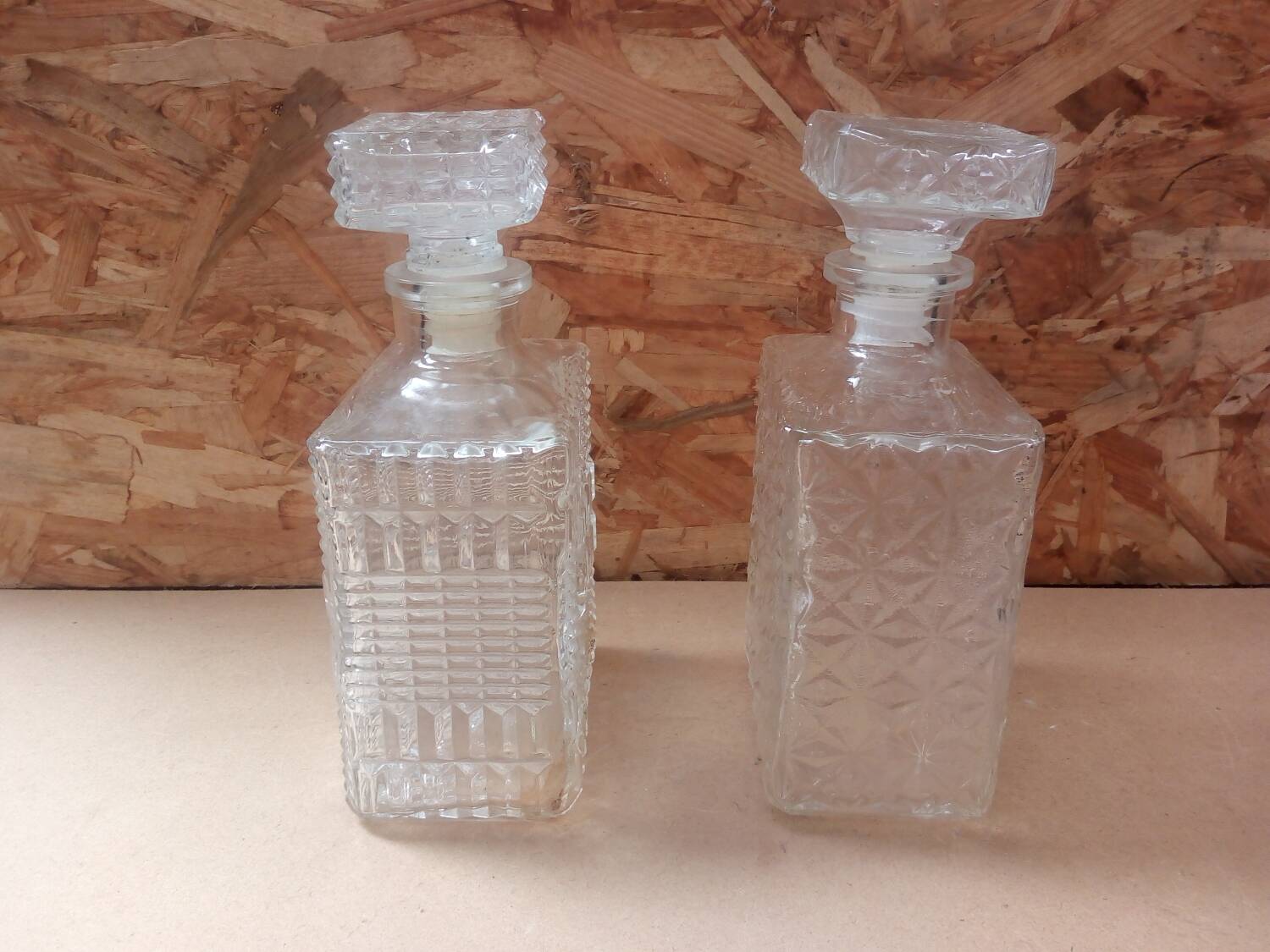 Pair of molded glass whiskey liqueur carafes + vintage stoppers