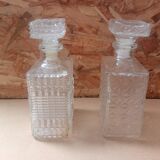 Pair of molded glass whiskey liqueur carafes + vintage stoppers
