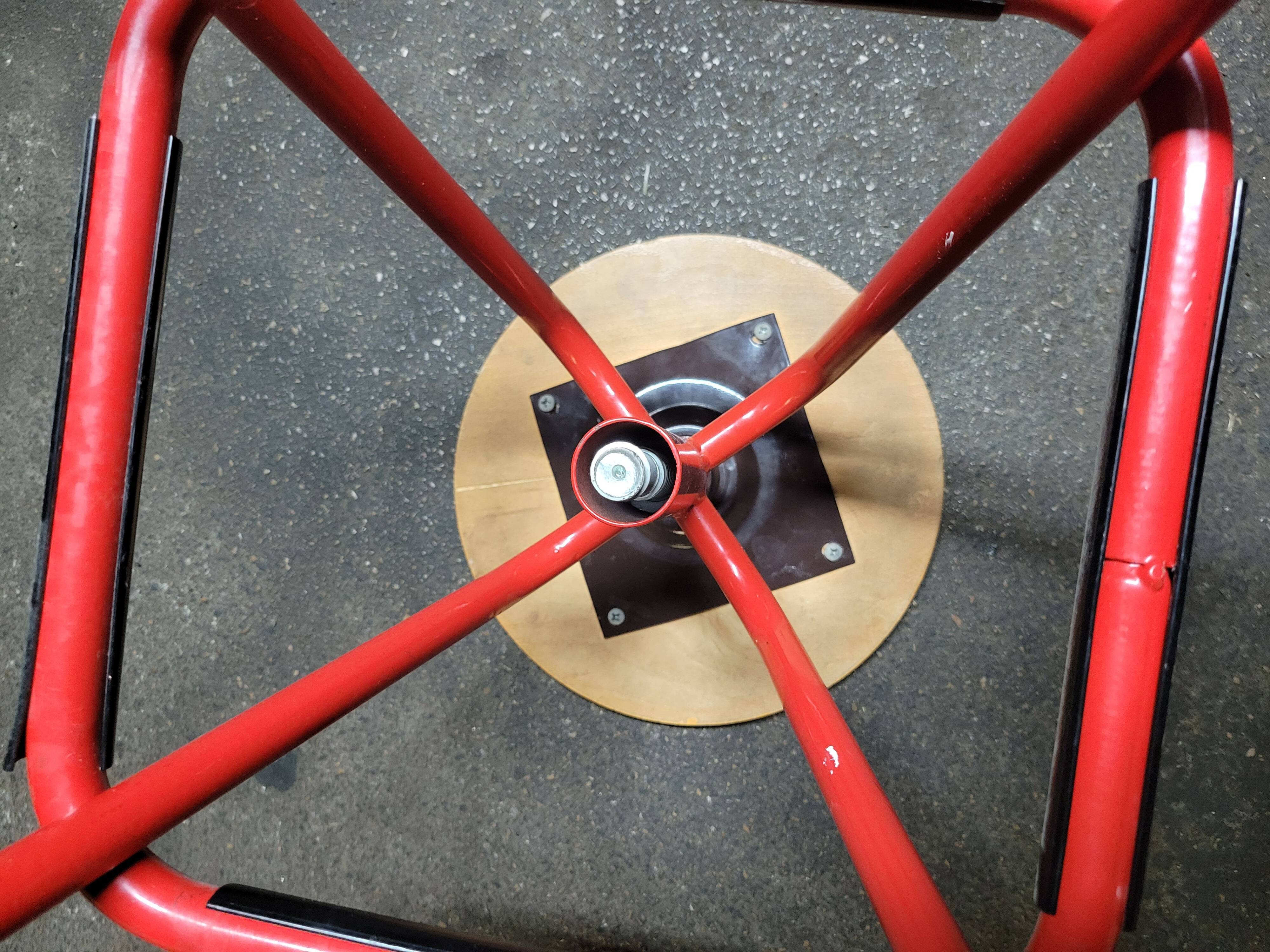 Red stool with industrial vintage screw 80s